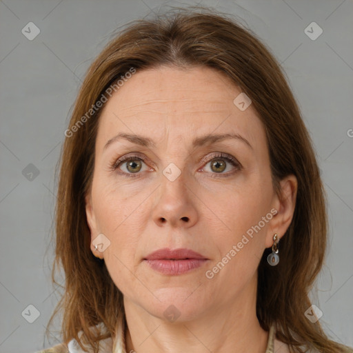 Joyful white adult female with medium  brown hair and grey eyes