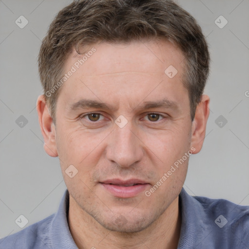 Joyful white adult male with short  brown hair and brown eyes