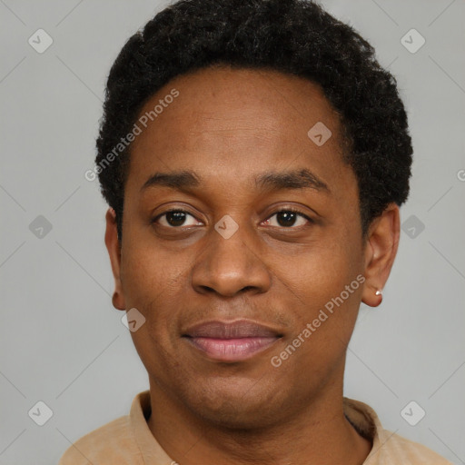 Joyful black young-adult male with short  black hair and brown eyes