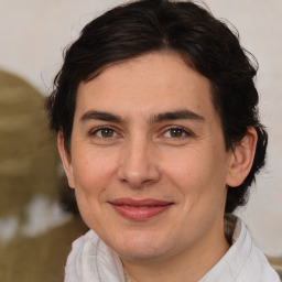 Joyful white adult female with medium  brown hair and brown eyes