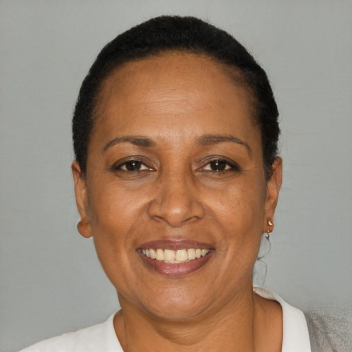 Joyful latino adult female with short  black hair and brown eyes