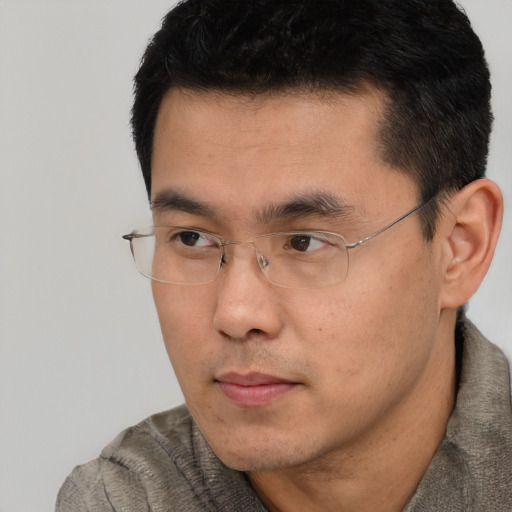 Neutral asian young-adult male with short  black hair and brown eyes