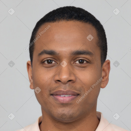 Joyful black young-adult male with short  black hair and brown eyes