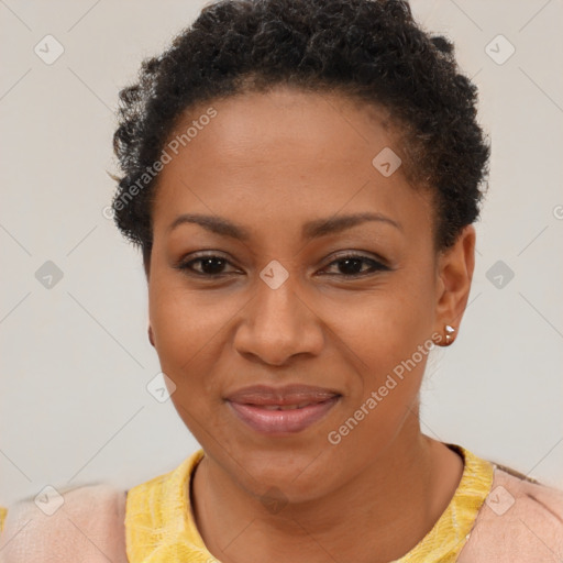 Joyful black young-adult female with short  brown hair and brown eyes