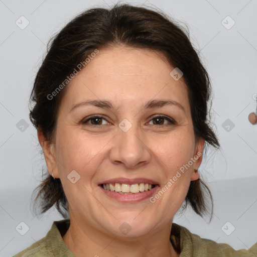 Joyful white adult female with medium  brown hair and grey eyes