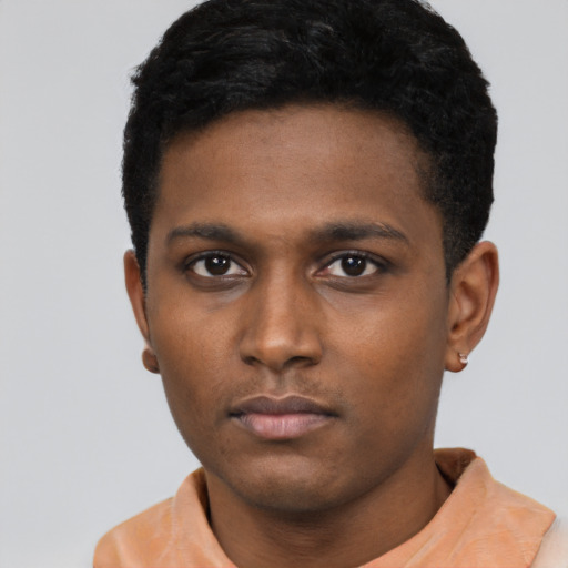 Neutral black young-adult male with short  black hair and brown eyes