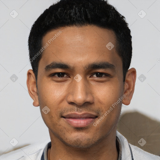 Joyful latino young-adult male with short  black hair and brown eyes