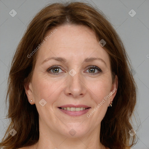 Joyful white adult female with medium  brown hair and grey eyes