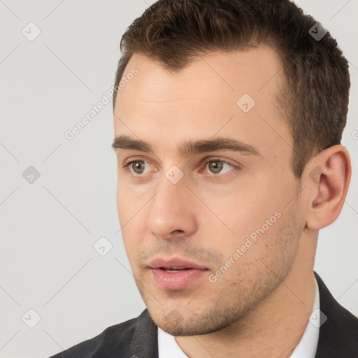 Neutral white young-adult male with short  brown hair and brown eyes