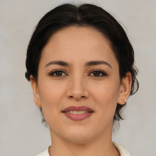 Joyful asian young-adult female with short  brown hair and brown eyes