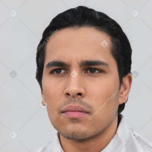 Neutral latino young-adult male with short  black hair and brown eyes