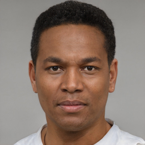 Neutral black young-adult male with short  black hair and brown eyes