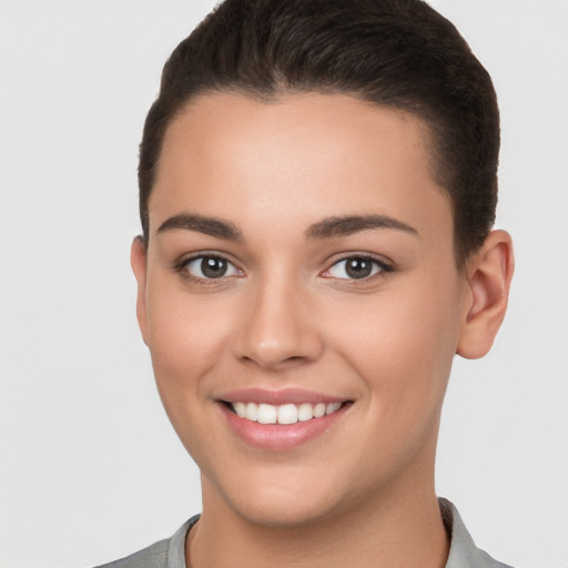 Joyful white young-adult female with short  brown hair and brown eyes