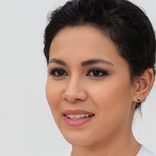 Joyful asian young-adult female with short  brown hair and brown eyes