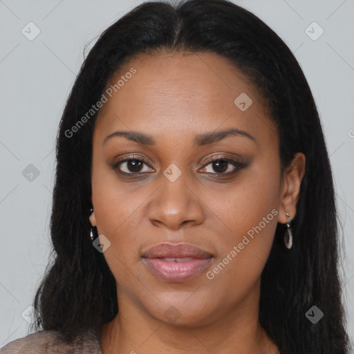 Joyful black young-adult female with long  brown hair and brown eyes