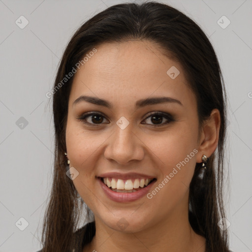 Joyful white young-adult female with long  brown hair and brown eyes