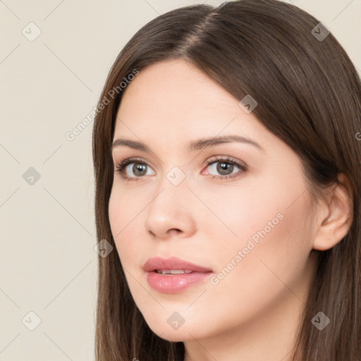 Neutral white young-adult female with long  brown hair and brown eyes