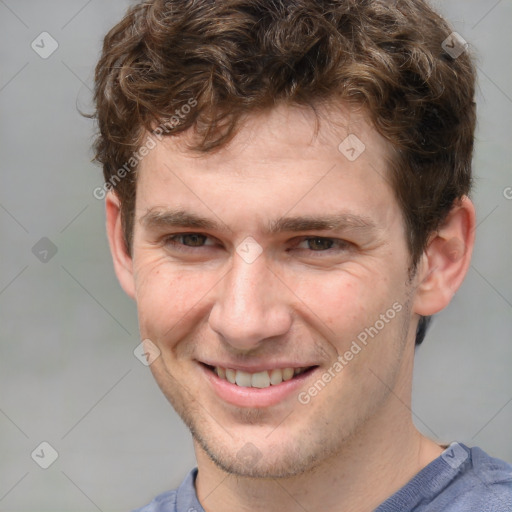 Joyful white adult male with short  brown hair and grey eyes