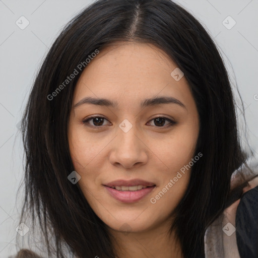 Joyful asian young-adult female with long  brown hair and brown eyes