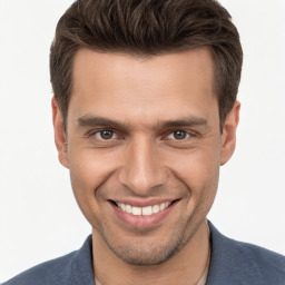 Joyful white young-adult male with short  brown hair and brown eyes