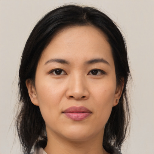 Joyful asian young-adult female with medium  brown hair and brown eyes
