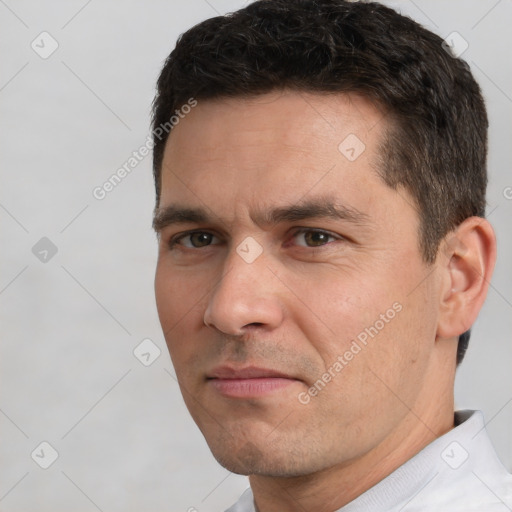 Neutral white adult male with short  brown hair and brown eyes