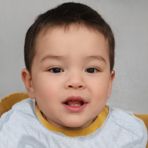 Joyful white child male with short  brown hair and brown eyes