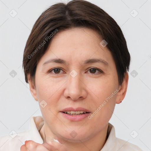 Joyful white adult female with short  brown hair and brown eyes