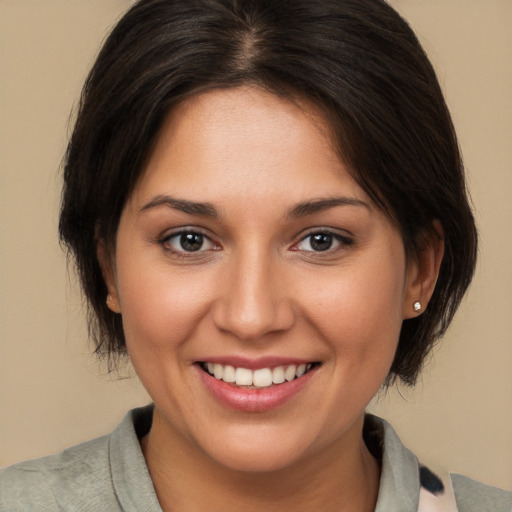 Joyful white young-adult female with medium  brown hair and brown eyes