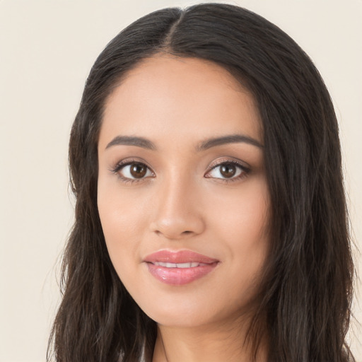 Joyful asian young-adult female with long  black hair and brown eyes