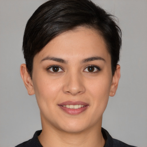 Joyful white young-adult female with short  brown hair and brown eyes