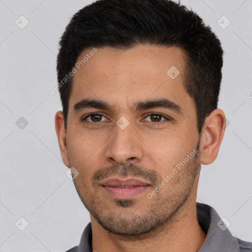 Joyful white young-adult male with short  black hair and brown eyes