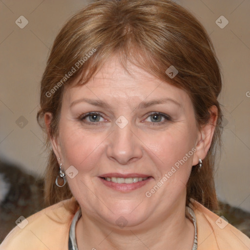 Joyful white adult female with medium  brown hair and brown eyes