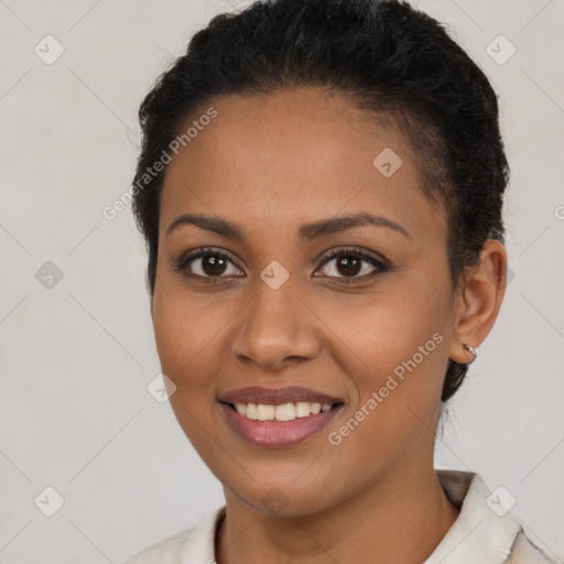 Joyful latino young-adult female with short  brown hair and brown eyes