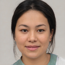 Joyful asian young-adult female with medium  brown hair and brown eyes