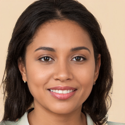 Joyful white young-adult female with medium  brown hair and brown eyes