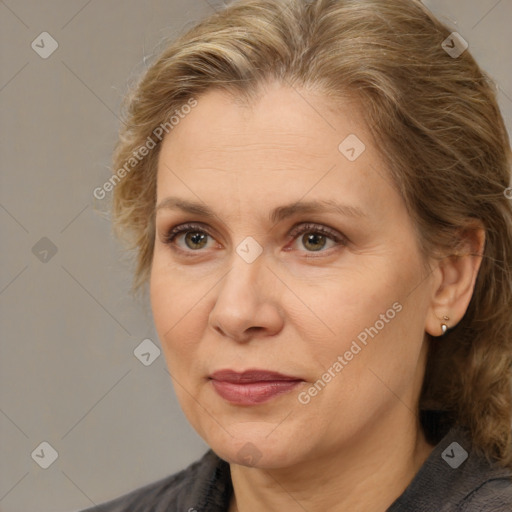 Joyful white adult female with medium  brown hair and brown eyes