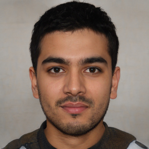Neutral latino young-adult male with short  black hair and brown eyes