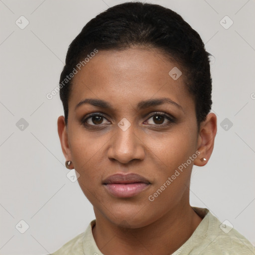 Joyful black young-adult female with short  brown hair and brown eyes