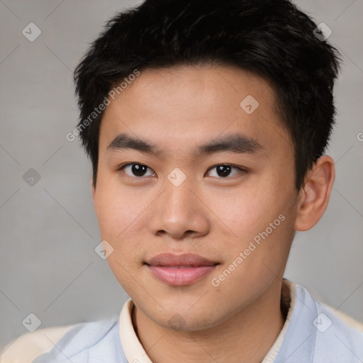 Joyful asian young-adult male with short  brown hair and brown eyes