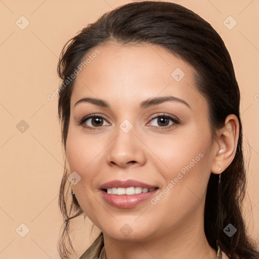 Joyful white young-adult female with long  brown hair and brown eyes