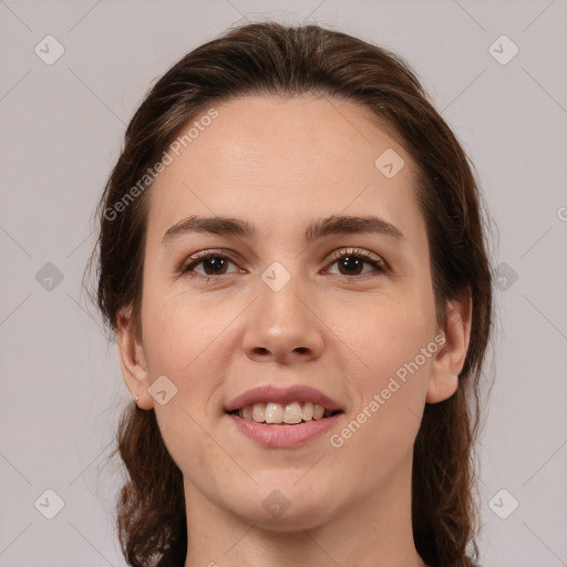 Joyful white young-adult female with medium  brown hair and brown eyes