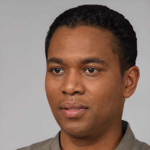Neutral black young-adult male with short  black hair and brown eyes