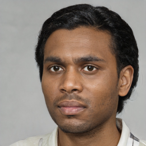 Neutral black young-adult male with short  black hair and brown eyes