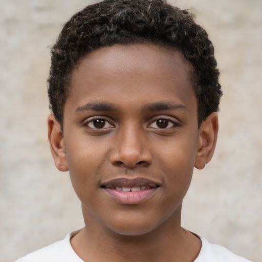 Joyful black young-adult male with short  brown hair and brown eyes