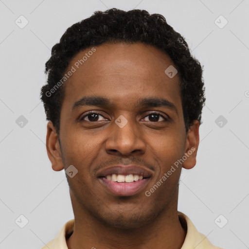 Joyful black young-adult male with short  black hair and brown eyes