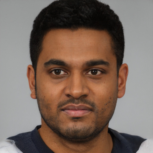 Neutral black young-adult male with short  black hair and brown eyes