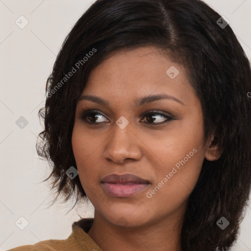 Joyful black young-adult female with medium  brown hair and brown eyes