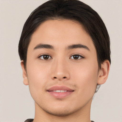 Joyful asian young-adult male with short  brown hair and brown eyes