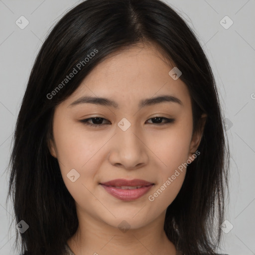 Joyful asian young-adult female with long  brown hair and brown eyes